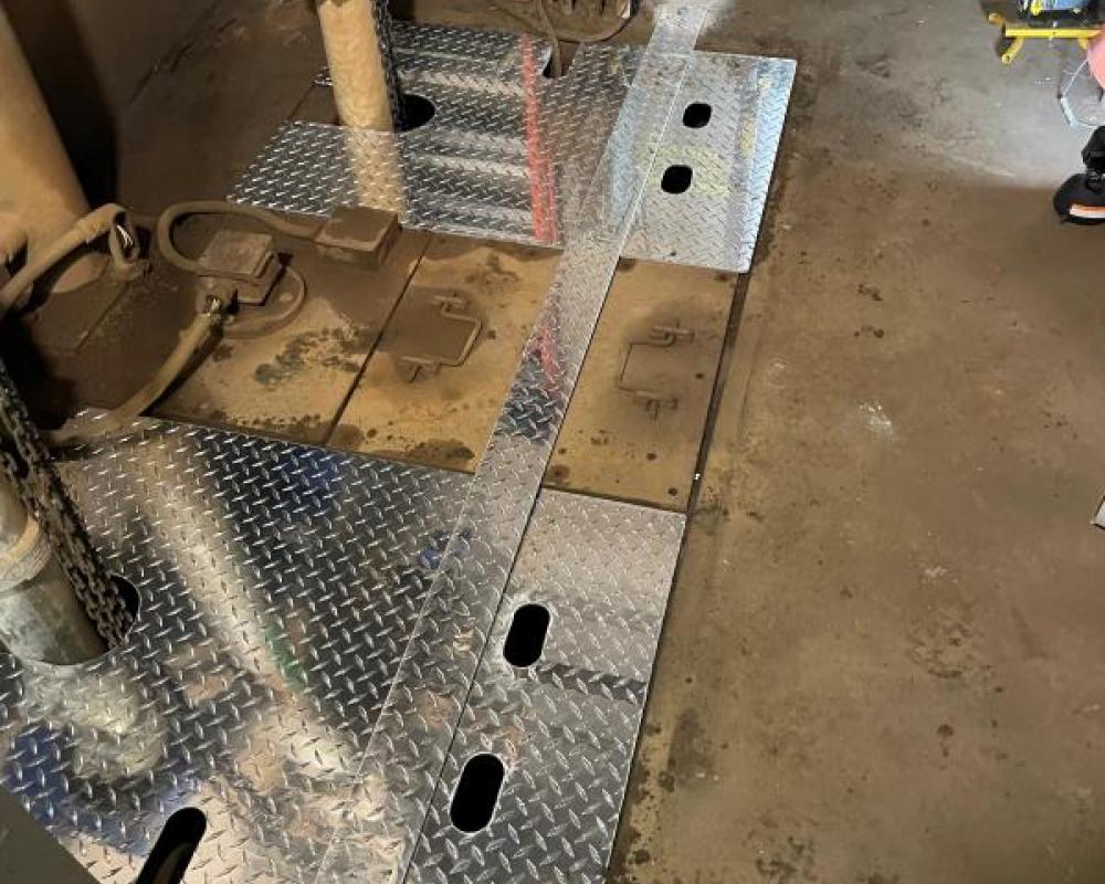 MOW workers install a new custom sump cover during Fix It Week