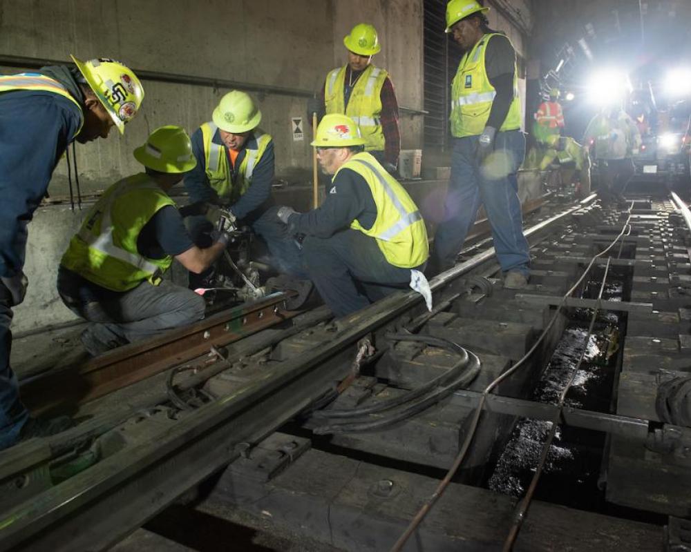 SFMTA Track Maintenance installs new rails at the Embarcadero Crossover 