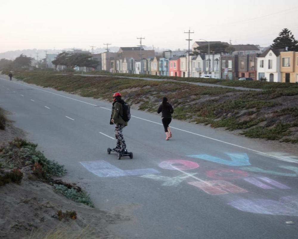 Runner and Skateboarder on Great Highway