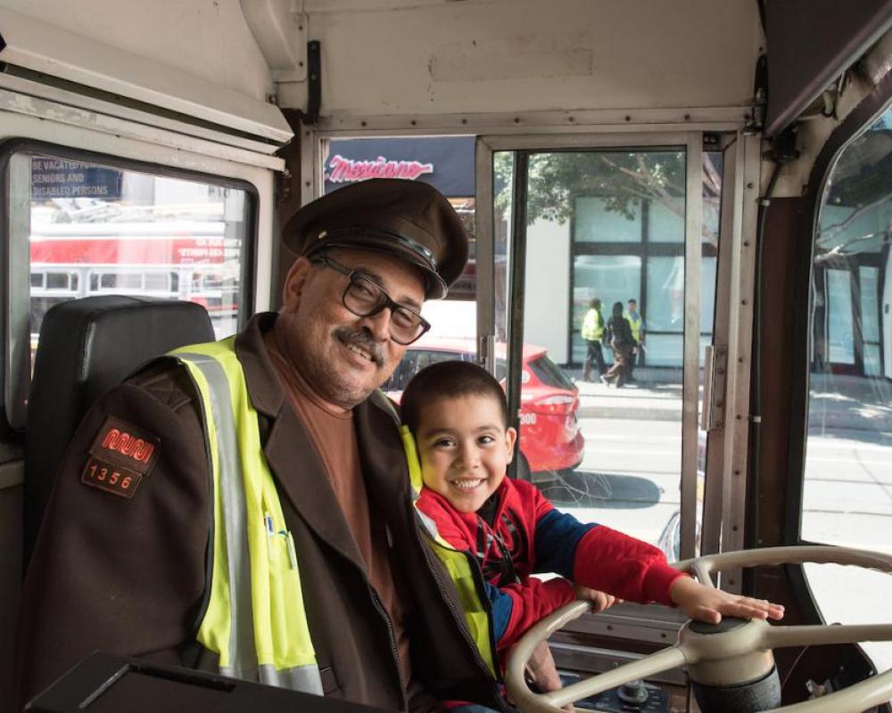 Operator with child at Muni Heritage Weekend