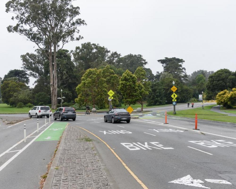 Bike and vehicle travel lanes looking west from Stanyan towards Golden Gate Park