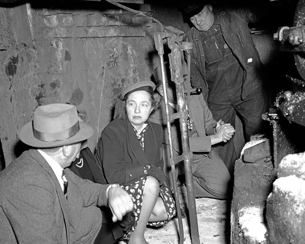 Friedel Klussman examining the Powell Market cable car turntable while spearheading the campaign to Save the Cable Cars in 1949.