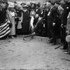 Mayor James Rolph Driving Ceremonial Spike for First Track Laid at the West Portal of the Twin Peaks Tunnel with Large Crowd | F