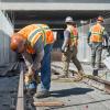 Sections of rail are bolted down on the west side of the tunnel portal, just north of the 4th and Bryant intersection.