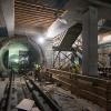 Workers construct final structural elements of the Yerba Buena/Moscone station platform.