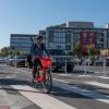 A person riding a JUMP bike on Terry Francois Blvd.