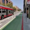 Photo of protected bikeway between 7th and 8th streets with Muni bus driving by - September 2020