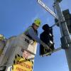SFMTA crews installing a bike signal