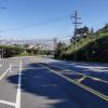 Clipper Street looking downhill at Grand View intersection with protected bikeway