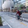 person biking in a two-way protected bikeway