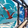 Photo showing three round decorative panels depicting St. Francis Square, the Fillmore and Japantown