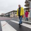 Image of Lou Grosso, a blind member of the Geary Community Advisory Committee, crossing the street at the new Buchanan crosswalk