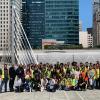 Photo of tour group on bridge with Salesforce Transit Center in the background.