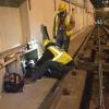 SFMTA Overhead Lines and Underground department perform preventative maintenance on a utility cable box at the Duboce Portal