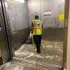 Custodians give the elevators at Forest Hill a deep clean