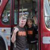 Family outside of historic bus during Muni Heritage