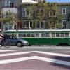 Decorative pavement, a person biking, and the F Streetcar