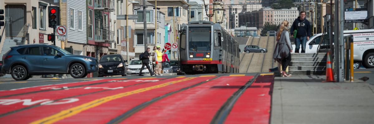 N Judah bus line with red transit lanes and visible boarding zone