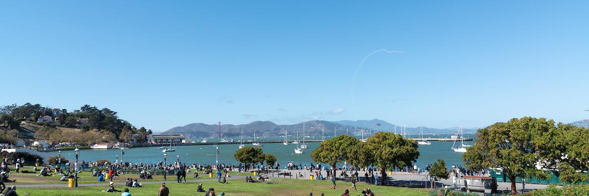 People enjoying views of Aquatic Park on a sunny day