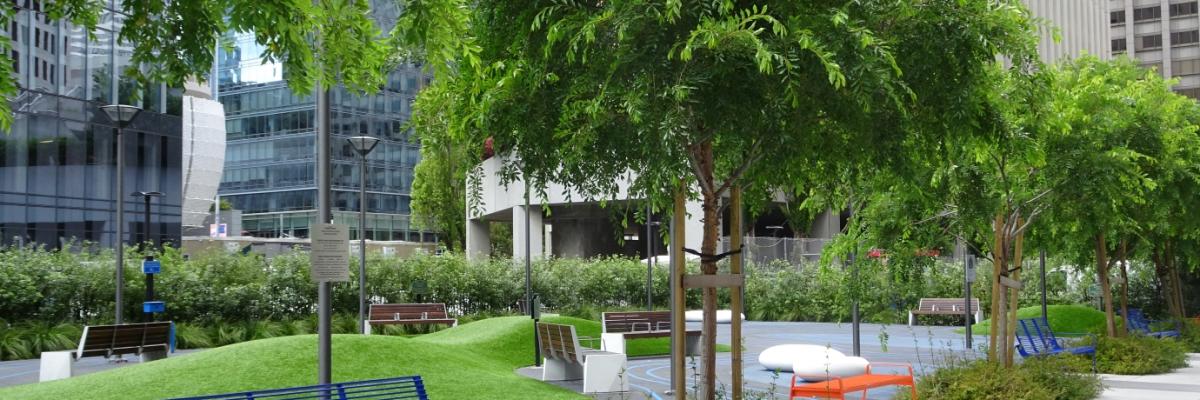 Recent trees and seating along Urban Park at the intersection of  Main and Howard streets