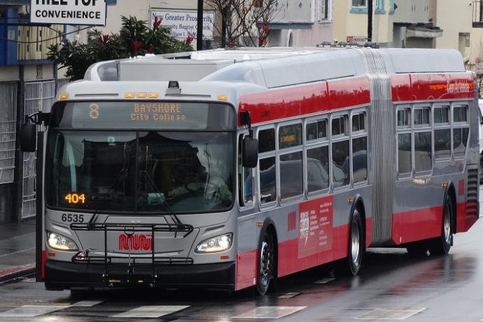 An 8 Bayshore Muni bus traveling on San Bruno Avenue.