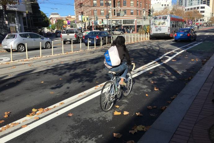 Cyclist using the newly installed raised bikeway