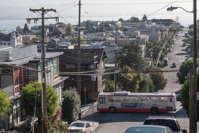 19 Polk bus driving through Potrero Hill with neighborhood and bay views in background