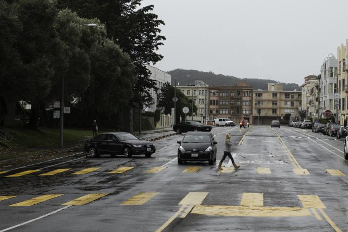 Woman crossing Bay Street in new high visibility school crosswalk