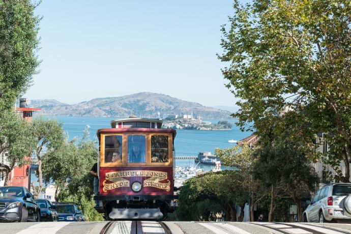 view of cable car and bay from hyde and chestnut streets in russian hill neighborhood