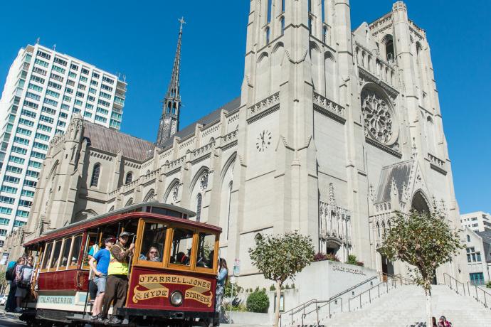 cable car passing grace cathedral on nob hill