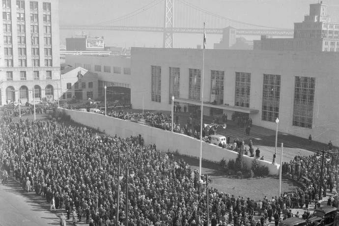 crowd with old transbay terminal and bay bridge