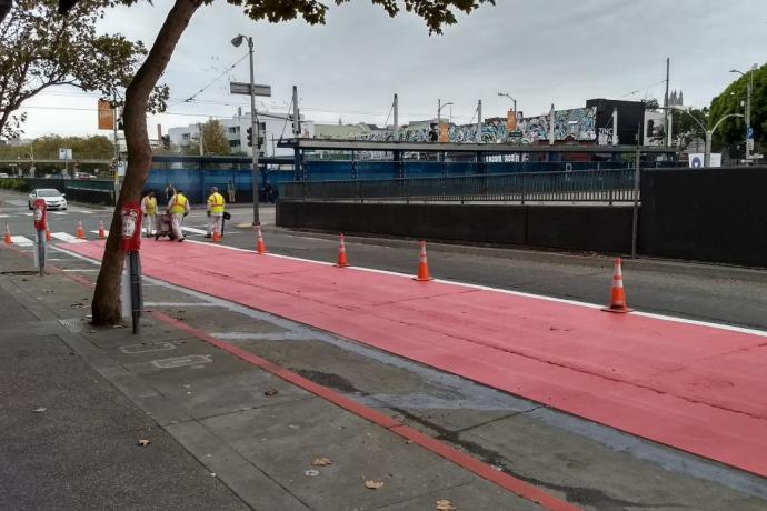 Red lanes being painted on Geary.