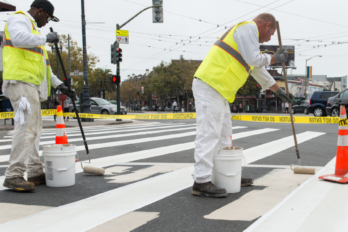 staff painting a new painted safety zone