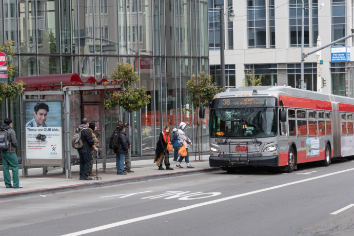 Passengers board 38 Geary on Geary at Van Ness