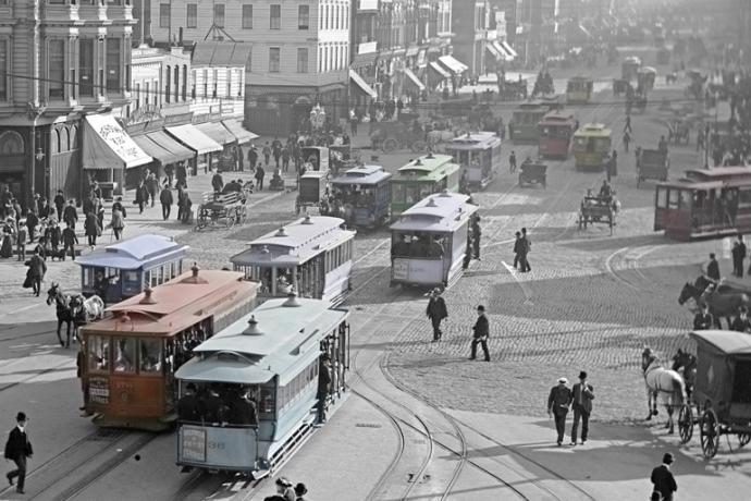 colorized photo of cable cars on market street at ferry building