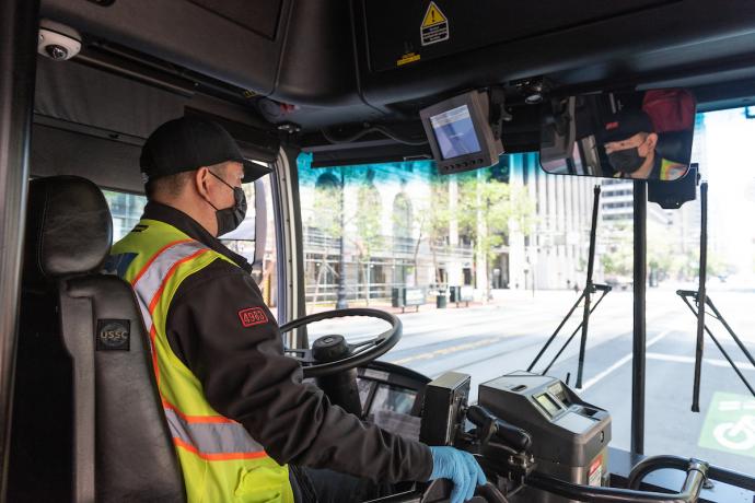 Photo of a bus operator wearing a mask