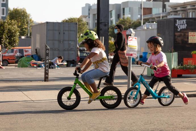 Children biking on a Slow Street