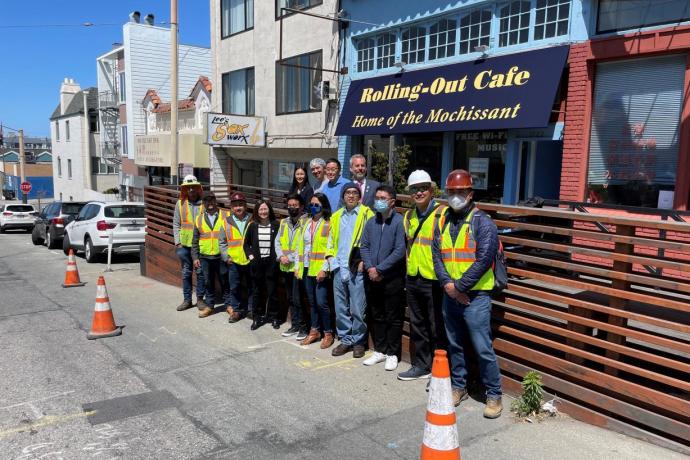Photo depicting Directors, Supervisor, Staff and Crew outside a cafe on Taraval St on a Shared Space parklet 