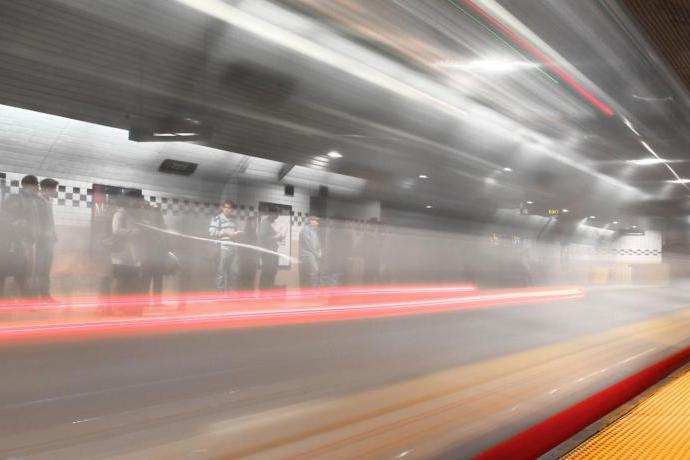 Blurred image of passing Muni train in a metro subway 