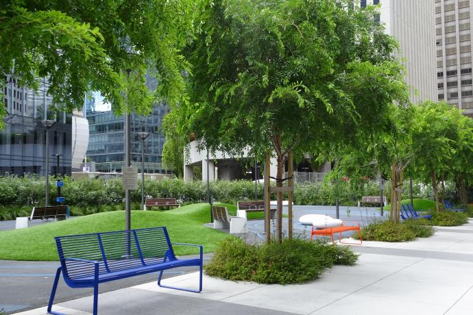 Recent trees and seating along Urban Park at the intersection of  Main and Howard streets