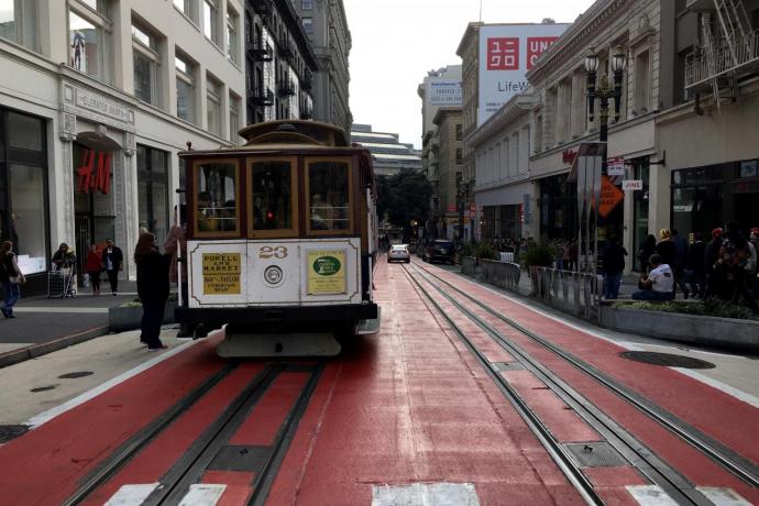 Image of a person boarding a cable car on Powell Street