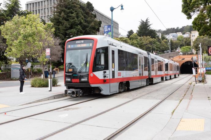 N Judah train on the street.