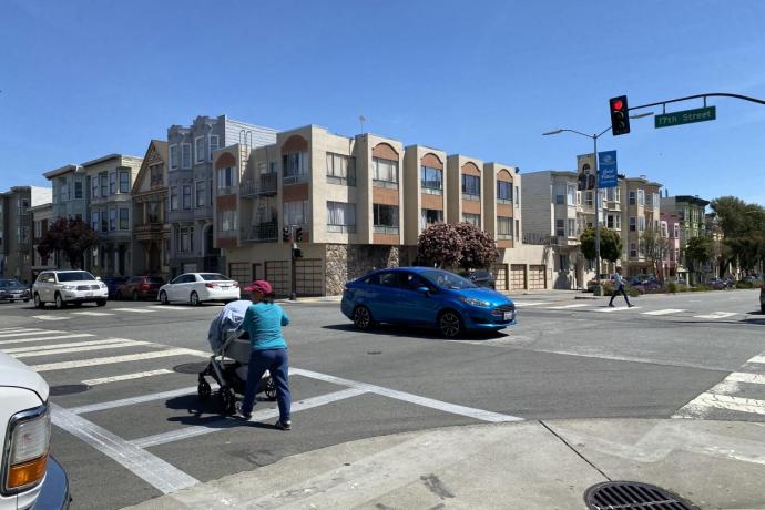 Pedestrian with stroller crossing Guerrero