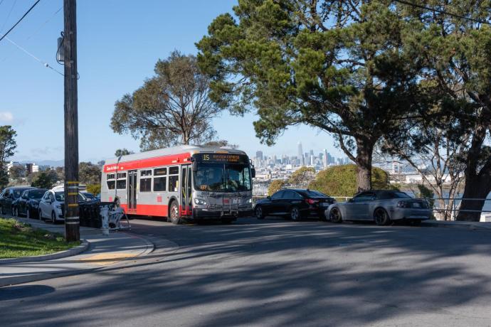 Muni line 15 with the San Francisco skyline in the background