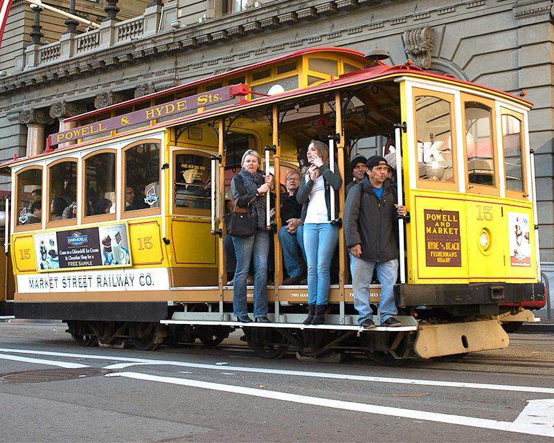 people riding a cable car