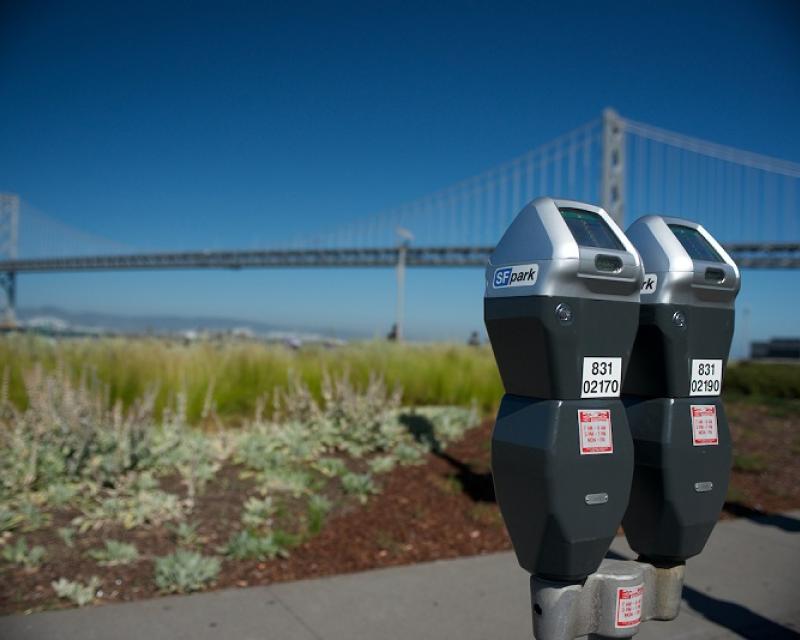 Picture of two parking meters on The Embarcadero with the Bay Bridge in the background