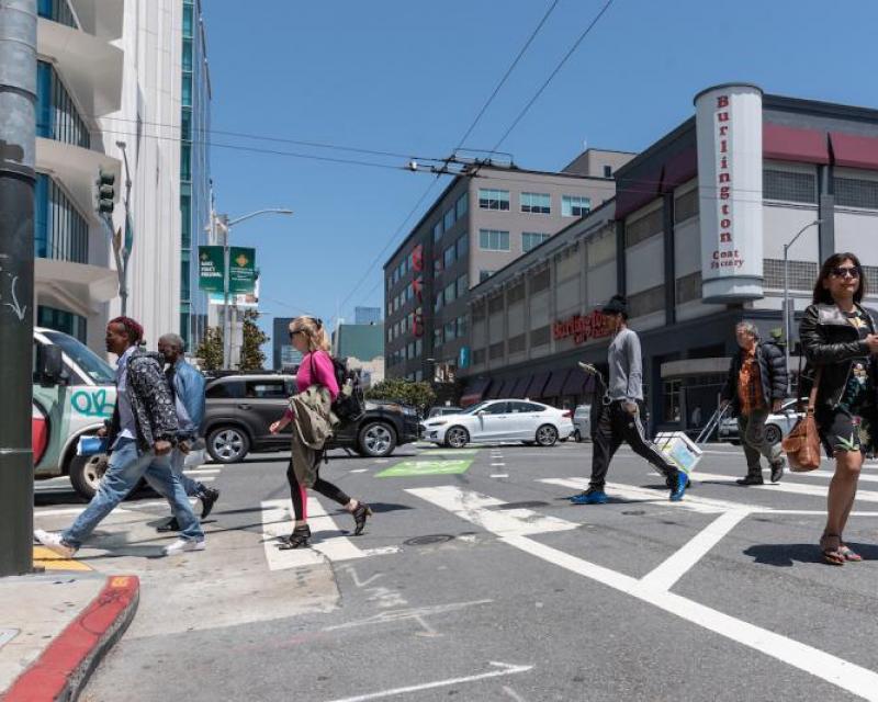 Pedestrians crossing on Howard and 5th. 