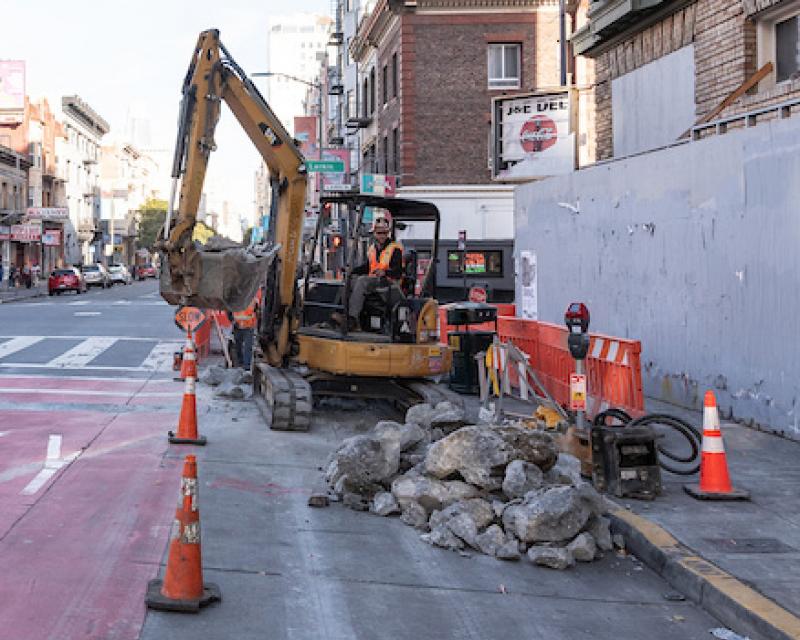 A safe path of travel between street construction and a building construction site