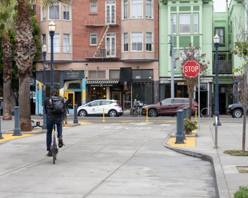 person biking on octavia street