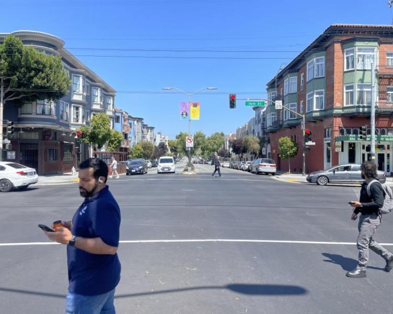 Pedestrians crossing east west crosswalks at intersection of 16th Street and Guerrero Street 